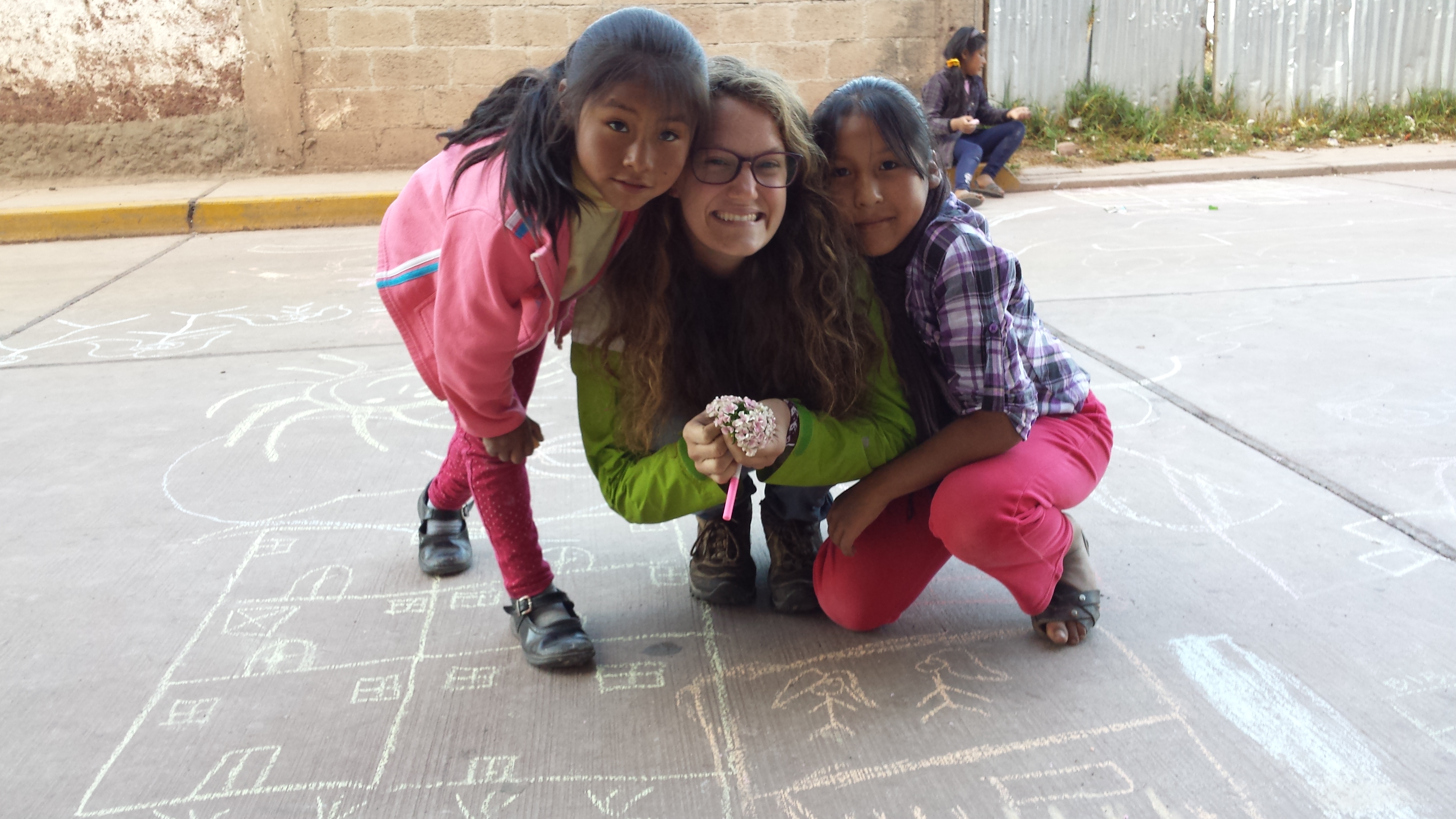 Michelle playing with two students