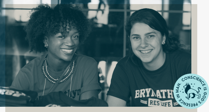 Bryn Athyn College Students smile at the camera, with a BAC sticker in the corner