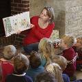 Student reads to children