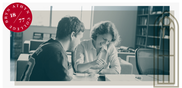 Student working together with a staff member