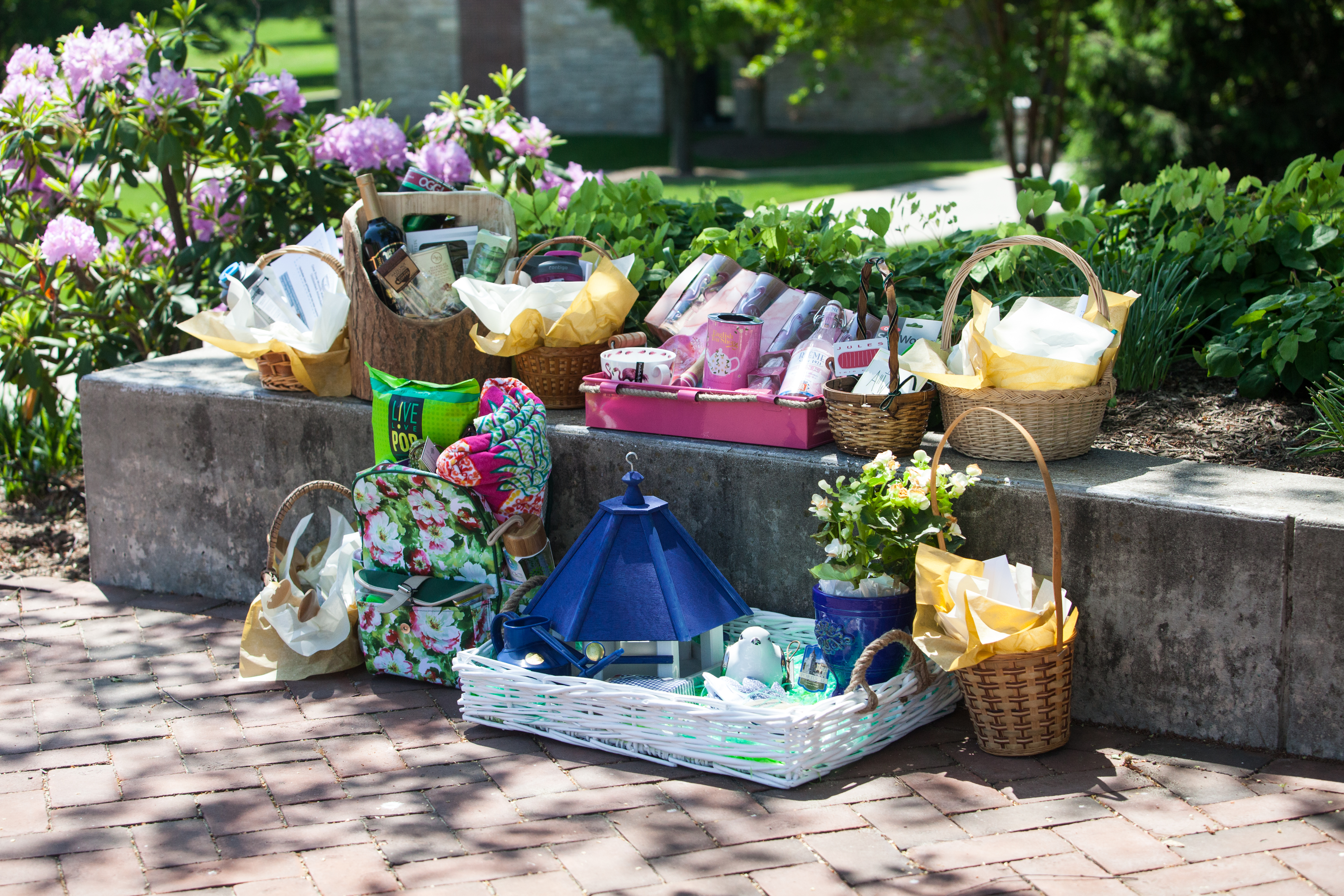 Gift baskets from a silent auction displayed on the terrace