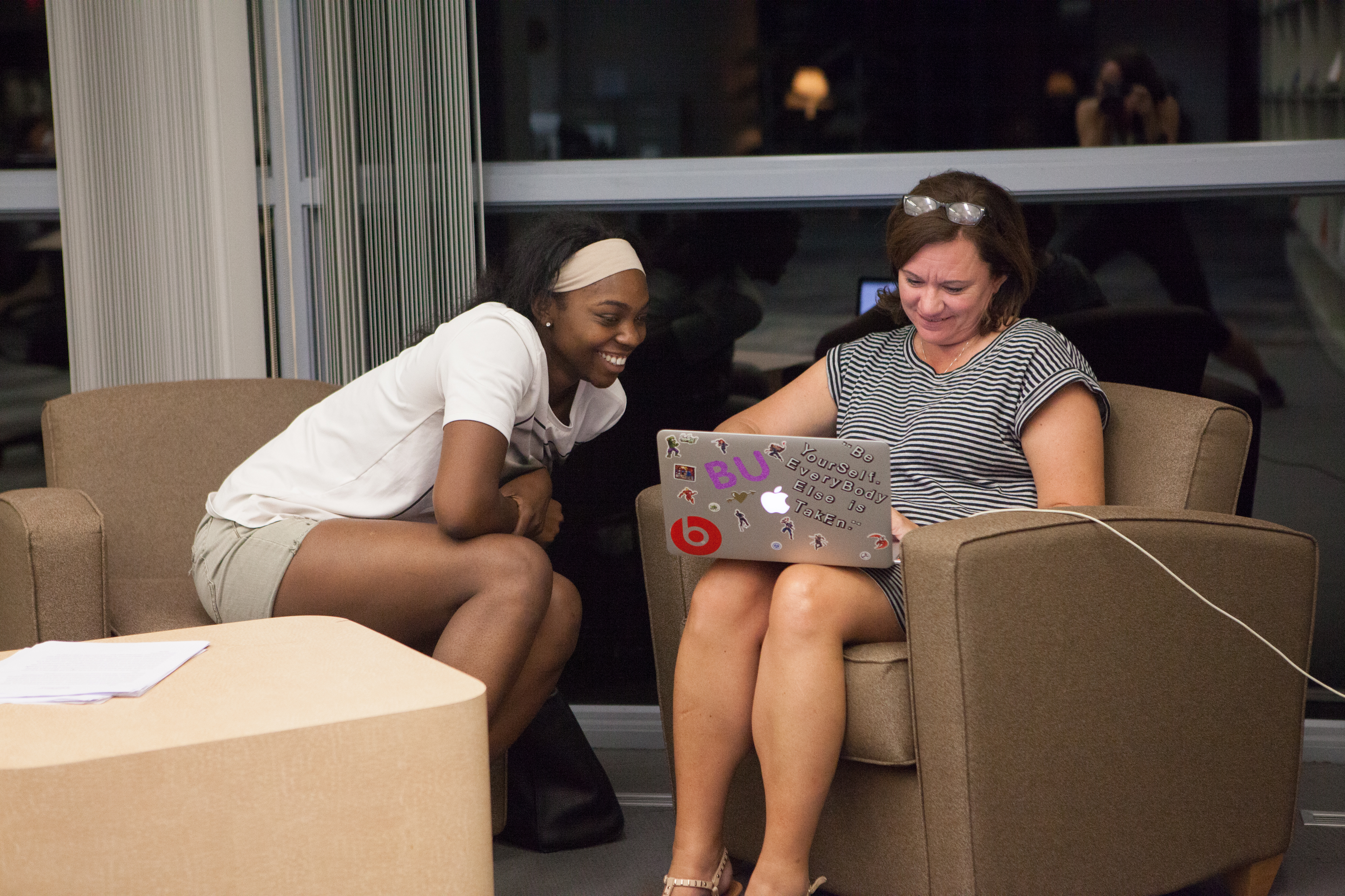 Bryn Athyn College student working with teacher on laptop