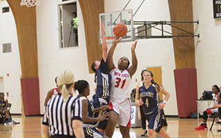 Students play basketball in the Asplundh Field House at Bryn Athyn College
