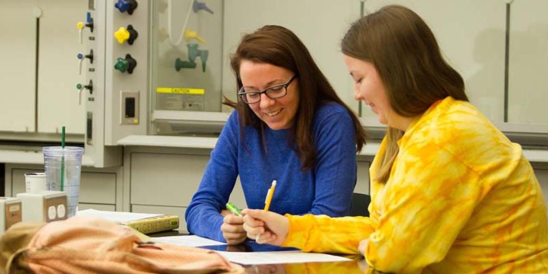 Academic Success Center tutor works with a student on an assignment