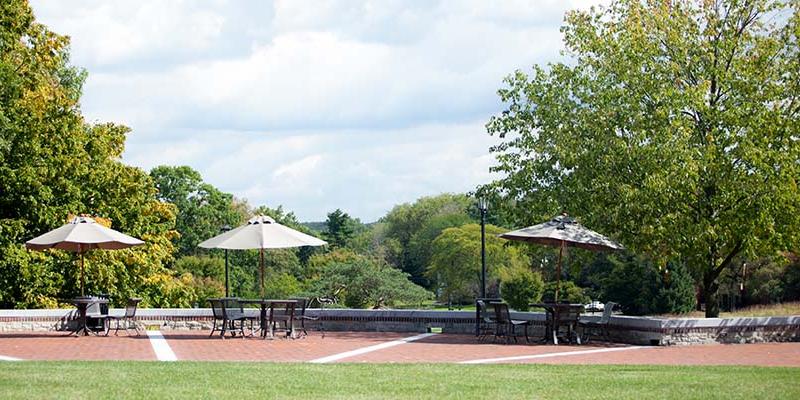 The Brickman quad and its tables with umbrellas