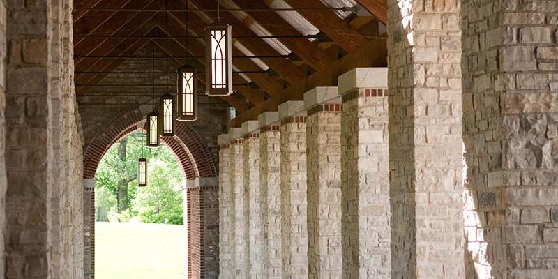 The stony Brickman Colonnade with the lanterns lit