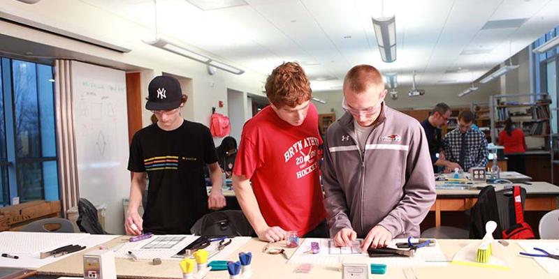 Bryn Athyn College students working on stained glass piece