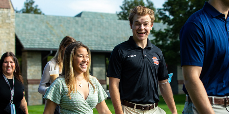 Two students walking outdoors