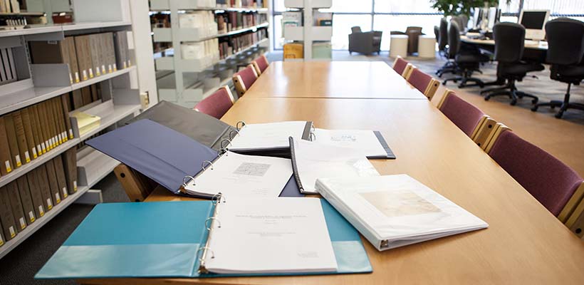 Presentation folders lying on a library table