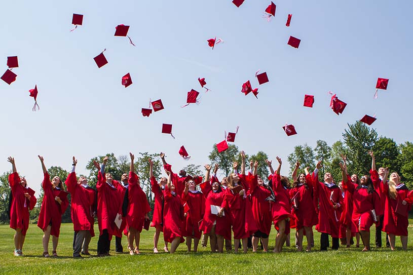 Bryn Athyn College student toss caps in air