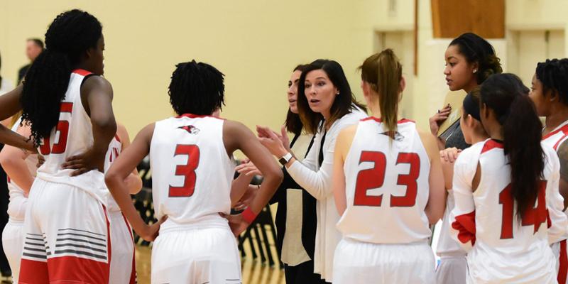 Bryn Athyn College Basketball coach Kayla Felty with her team in a huddle