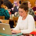 Student working on laptop in Brickman Dining Hall