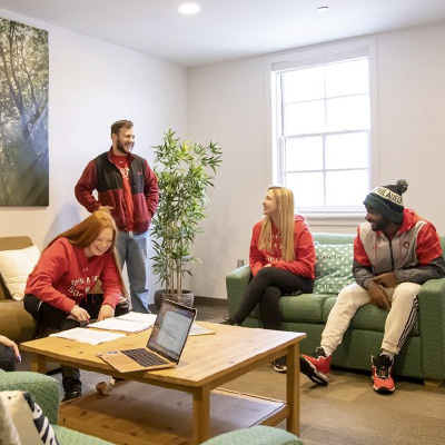 Students hanging out in one of the many residence hall common area