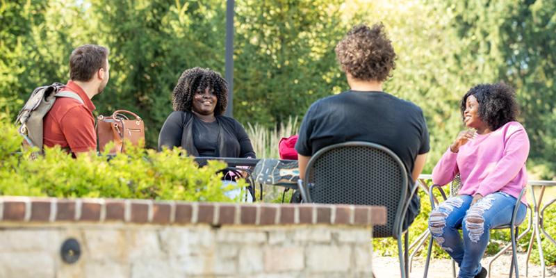 Students hanging out at College Center patio at Bryn Athyn College