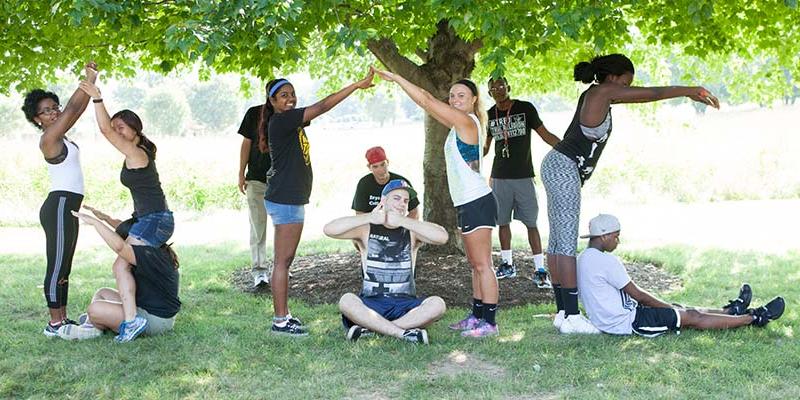 Bryn Athyn College students form letters B, A, and C with thier bodies