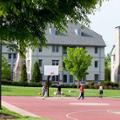 View of one of the residence halls overlooking the outdoor recreational basketball court