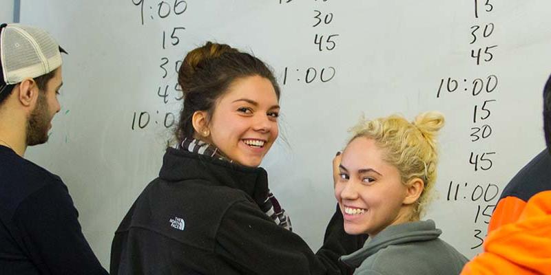 Students at white board in Doering Center at Bryn Athyn College