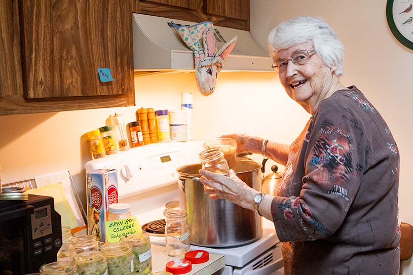 Woman cooking soup on the stovetop